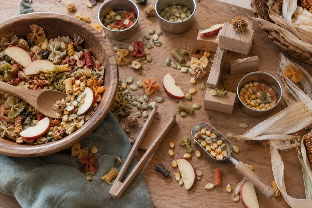 Open-ended fall loose-parts and pasta play inspired by apples, pumpkins and corn.